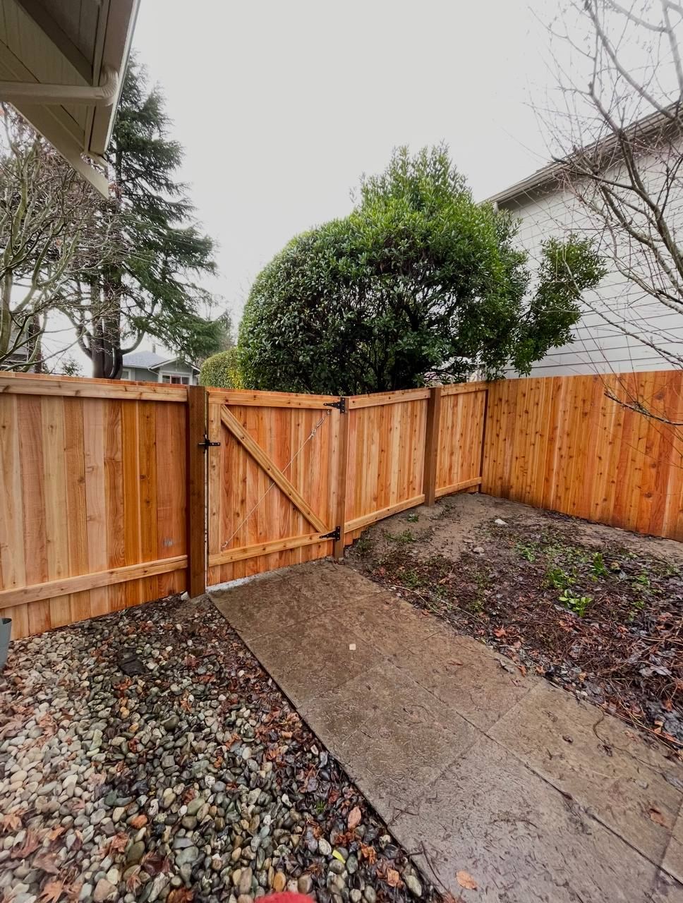 Cedar fence corner with braced gate and walkway